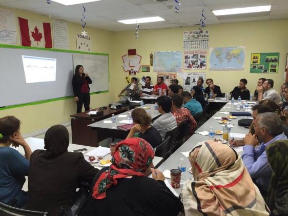 Mona Mona teaching immigrants in Toronto.